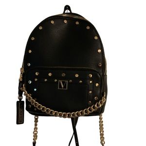 The Victoria small backpack Black Accented with gold studs V-Monogram
